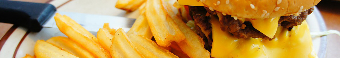 Eating Burger Fast Food at Southeast Carry Out restaurant in Wichita, KS.